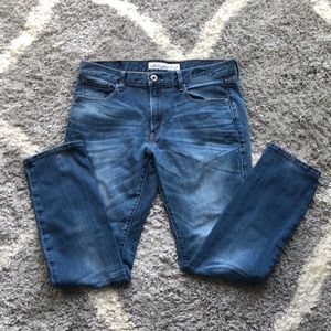 Express men’s skinny fit jeans. Light wash